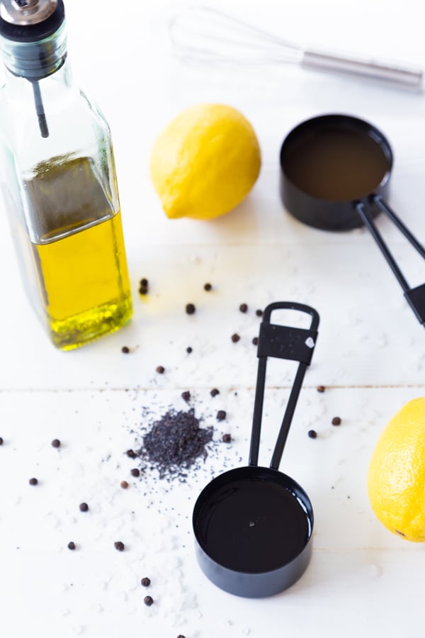 A lemon, olive oil, apple cider vinegar, and spices for salad dressing