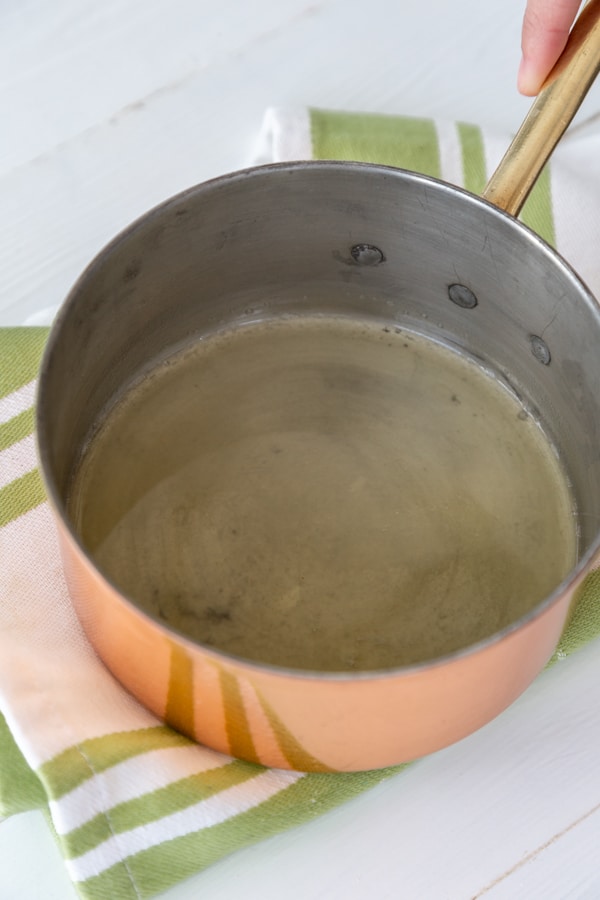 Melted butter in a copper pan.