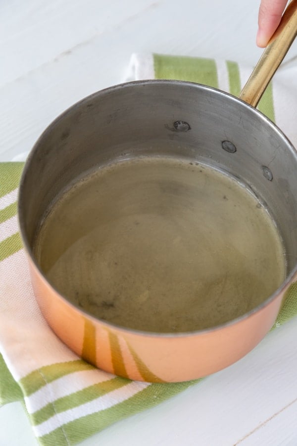 Melted butter in a copper pan.