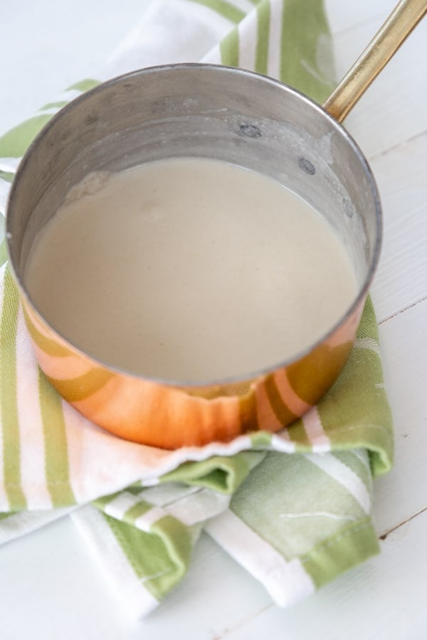 Milk and flour mixture in a copper pan.