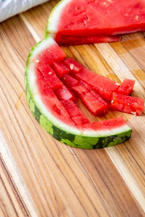 Half of a slice of watermelon cubed.