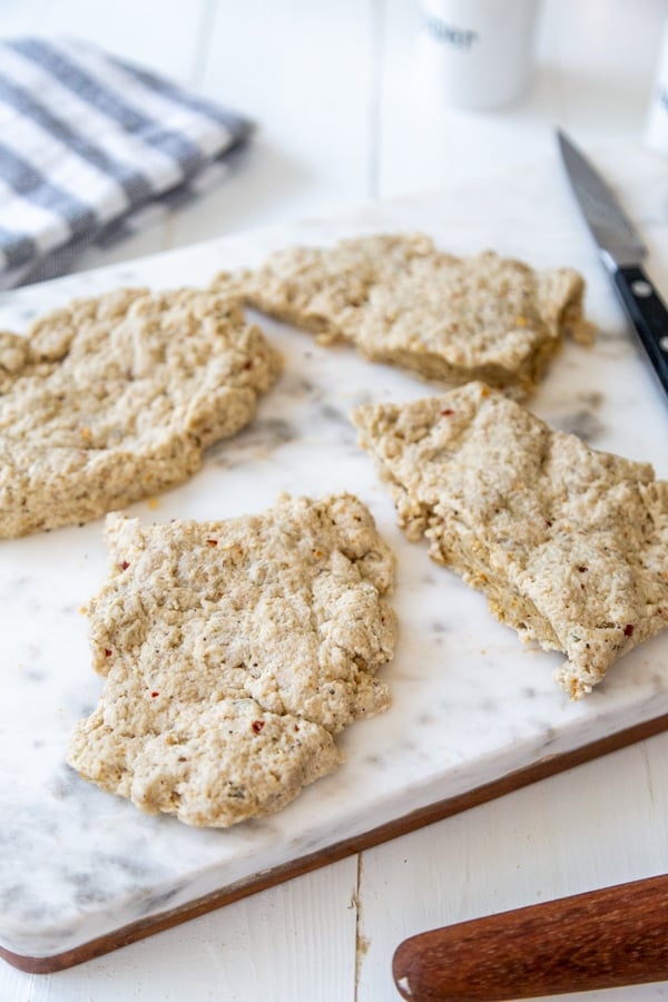 Seitan cutlets on a marble board.