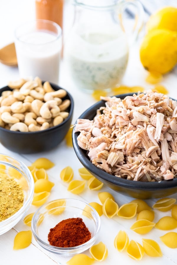 Ingredients for buffalo mac and cheese on a white table. 