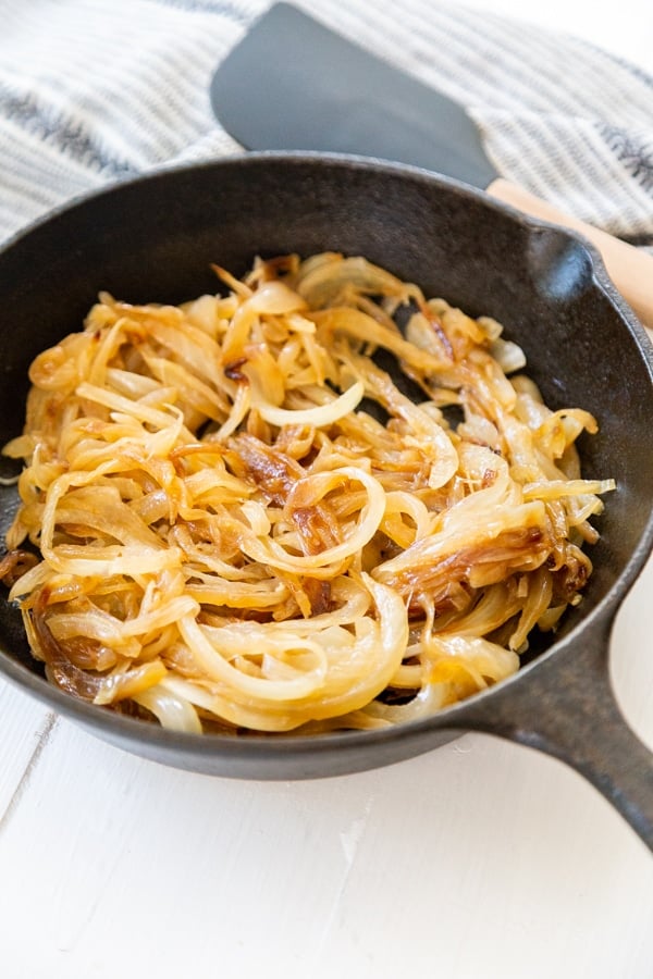 A black skillet with caramelized onions.