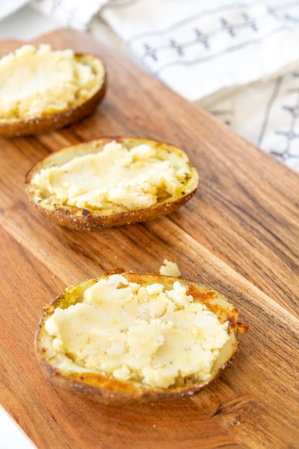 Baked potato halves filled with a cheesy potato filling.