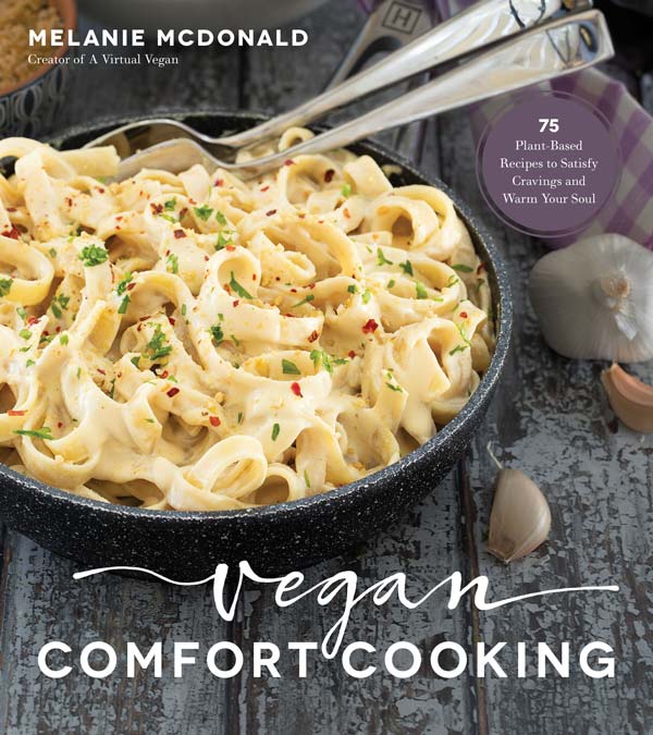 The cover of Vegan Comfort Cooking with a picture of a bowl of Alfredo with pasta. 