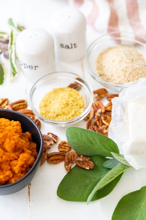 Ingredients for pumpkin ravioli filling with pumpkin puree sage nutritional yeast breadcrumbs and pecans