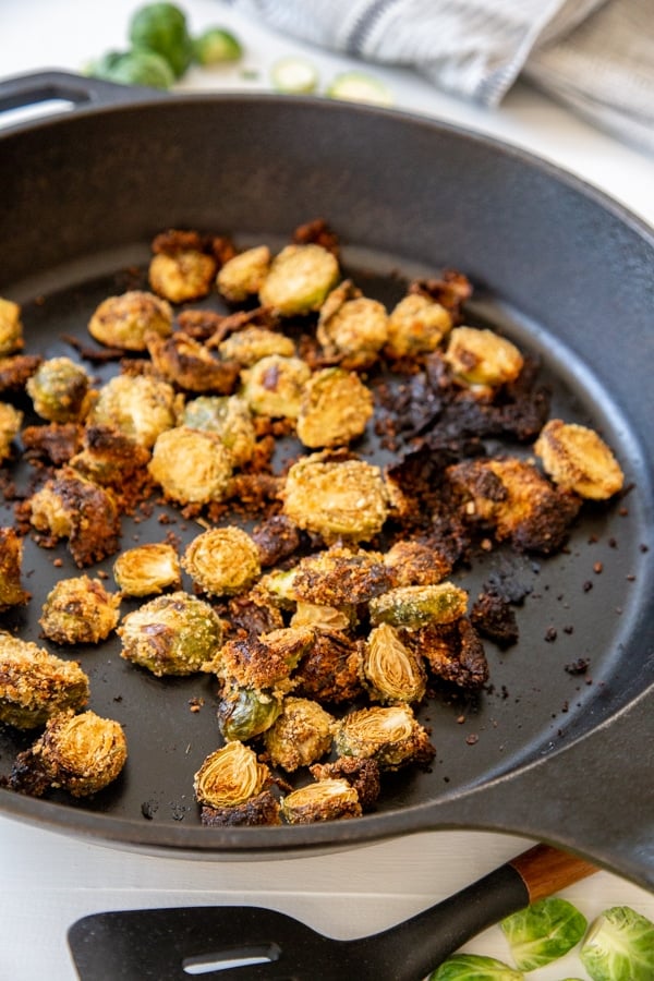 Breaded roasted Brussels sprouts in an Iron Skillet.