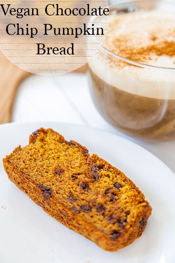 Vegan Chocolate Chip Pumpkin bread on a white plate with a large vegan cappucino