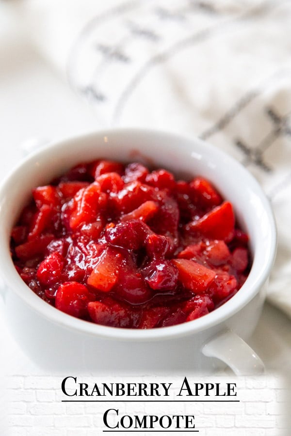 A Pinterest pin for cranberry apple compote with a picture of the compote in a white bowl. 