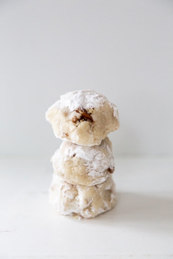 3 tea cake cookies stacked on top of each other on a white surface. 