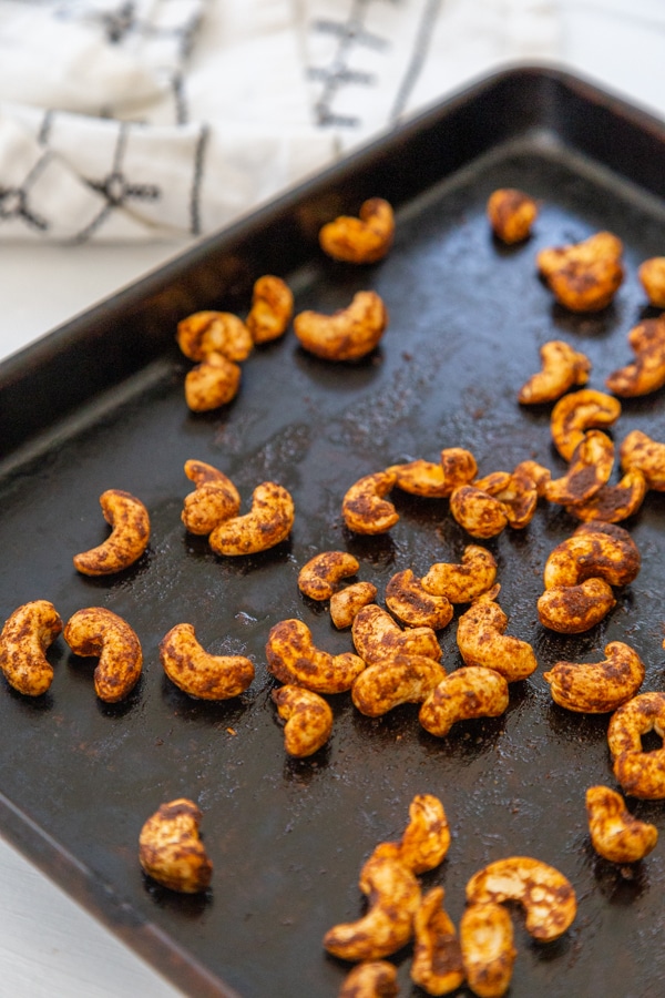 Spiced nuts on a baking sheet.