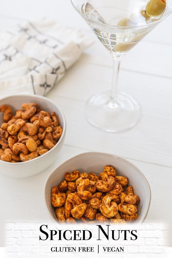 A Pinterest pin for spiced nuts with a picture of 2 bowls of the nuts. 