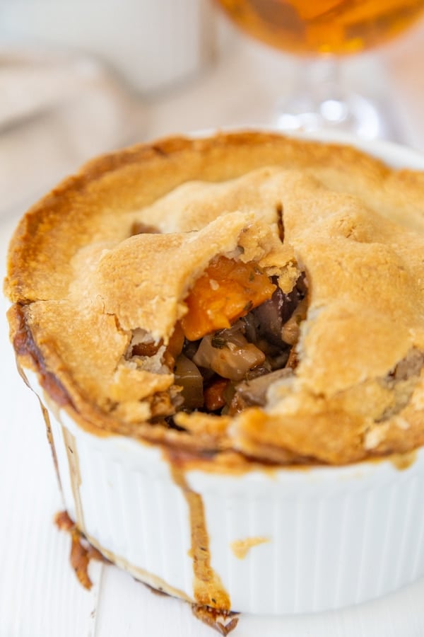 A vegetable pot pie with a piece taken out of the center. 