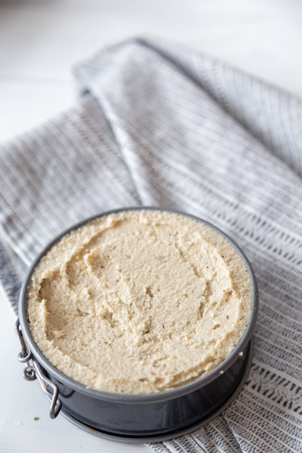 A small springform pan with spreadable cashew cheese. 