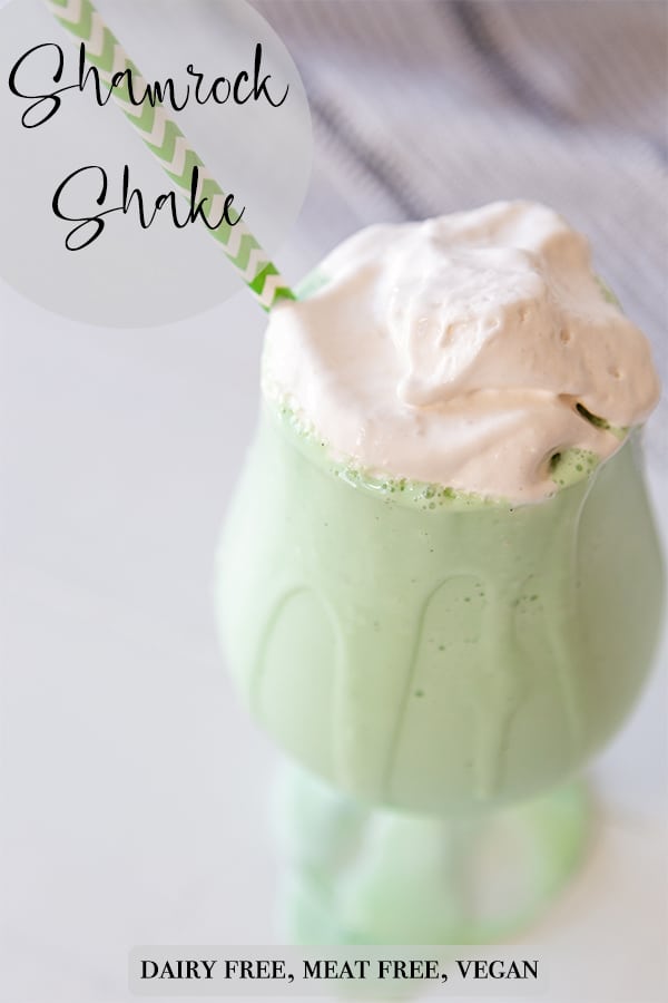 A Pinterest pin for a vegan shamrock shake with a picture of the shake with a green and white straw in the glass. 