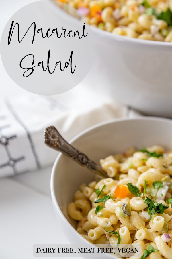 A Pinterest pin for vegan macaroni salad with a picture of the salad. 