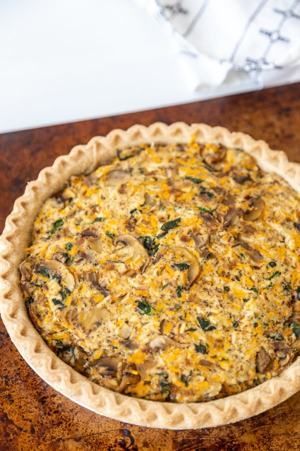 A vegetable quiche on a baking sheet. 