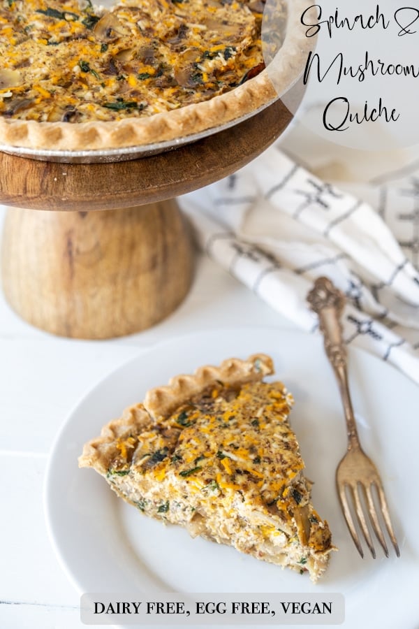 A Pinterest pin for vegan spinach and mushroom quiche with a picture of the quiche and a slice of it on a white plate. 