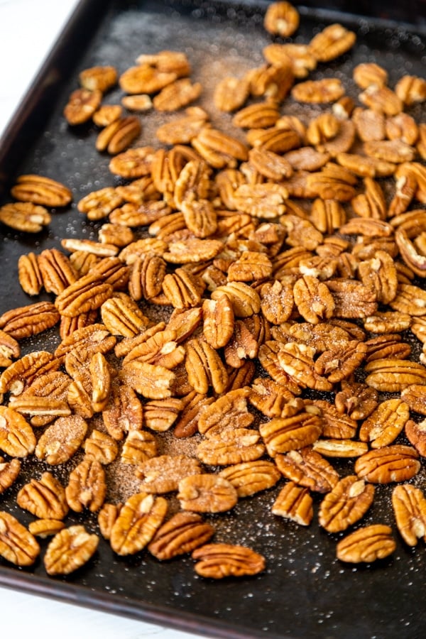 A baking sheet with toasted pecans.