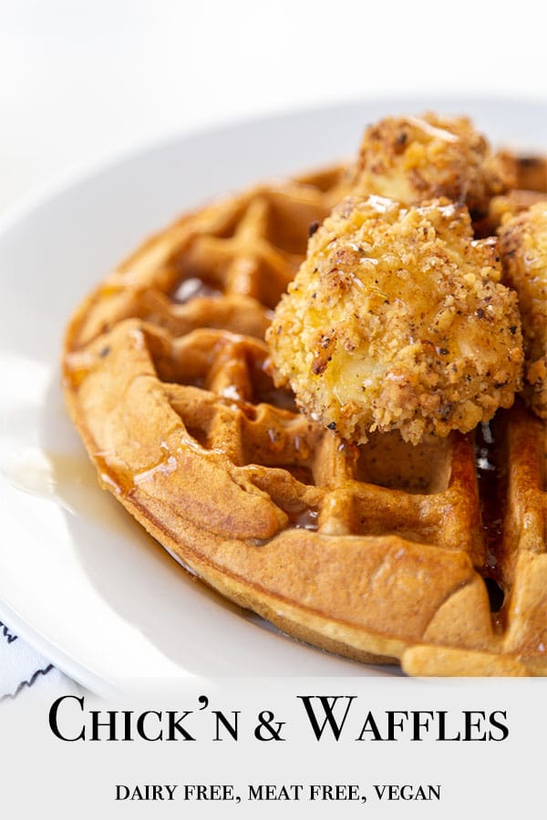 A Pinterest pin for vegan chicken & waffles with a picture of half of a white plate with a Belgian waffle topped with cauliflower chicken and maple syrup.
