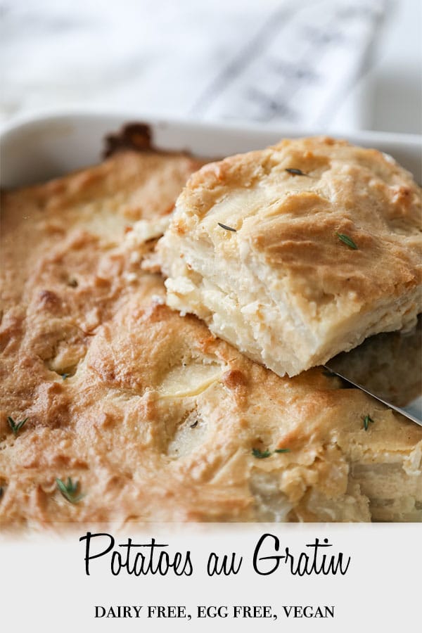 A Pinterest pin for vegan potatoes au gratin with a pan of the gratin and a square piece being lifted from the pan.