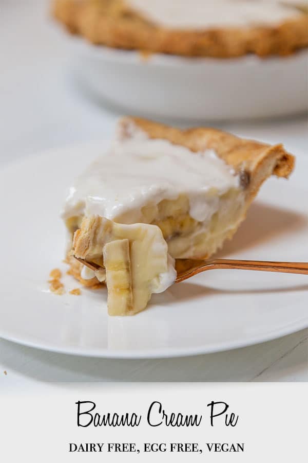 A Pinterest pin for vegan banana cream pie with a slice of the pie on a white plate and a copper fork with pie on it.