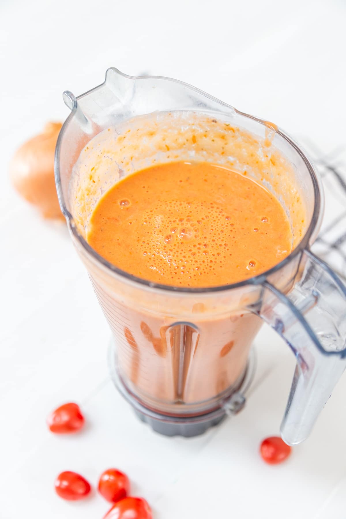 A blender with blended vodka sauce.