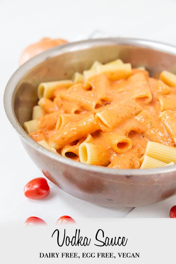 A Pinterest pin for vegan vodka sauce with a picture of the sauce on rigatoni in a pan.