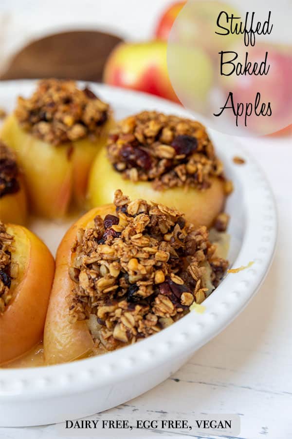 A PInterest pin for vegan stuffed baked apples with a picture of the stuffed apples in a round white pie dish.