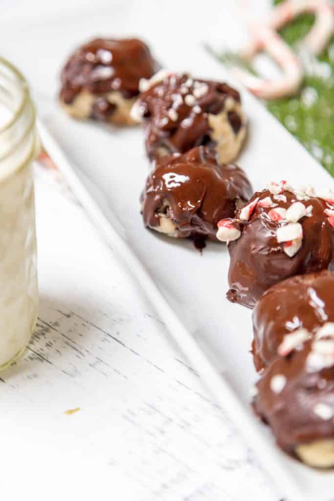 Chocolate and peppermint cookie dough bites on a long white platter.