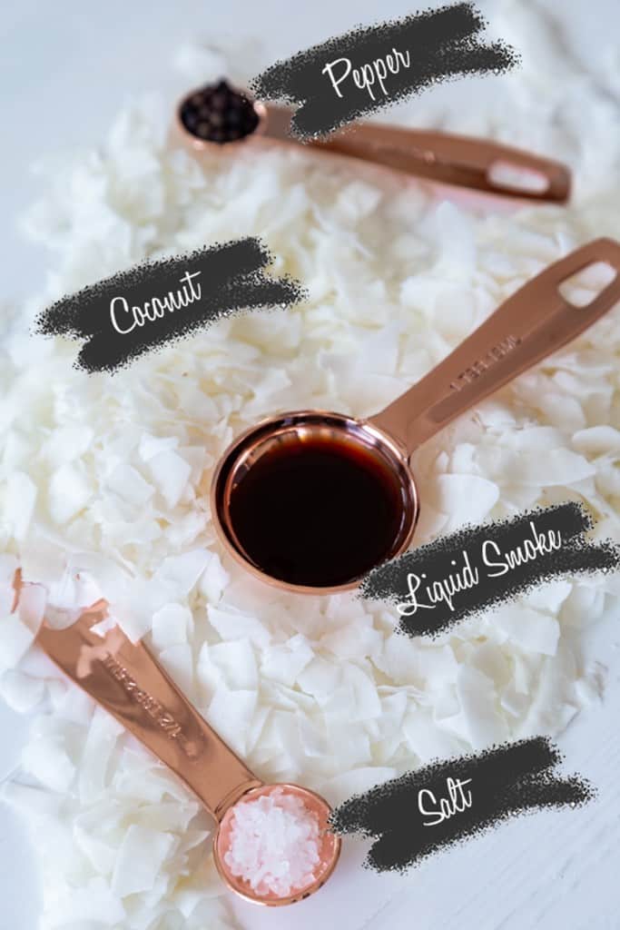 The ingredients for coconut bacon on a white table.