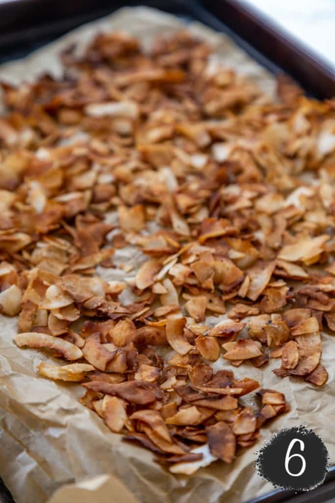 A baking sheet with coconut bacon.