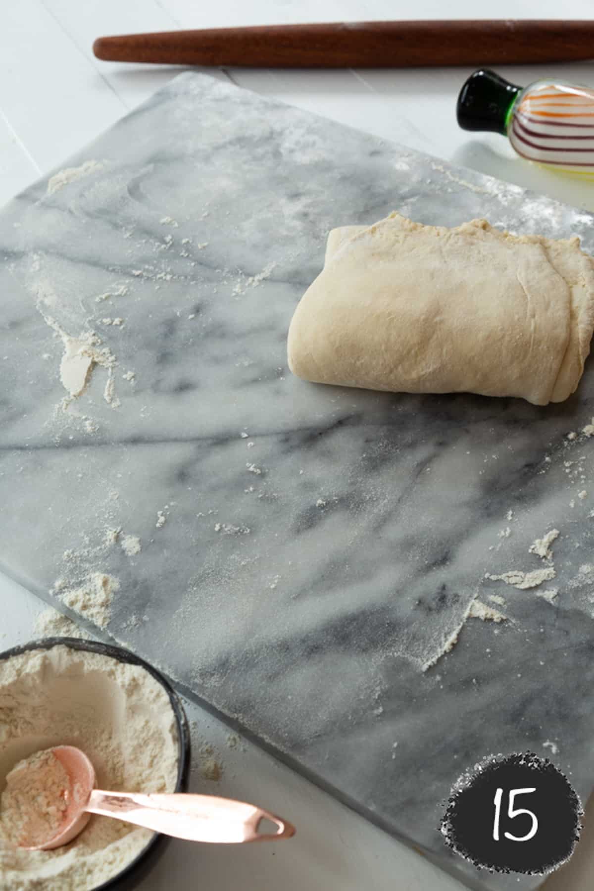 Dough and butter rolled into a thick square.