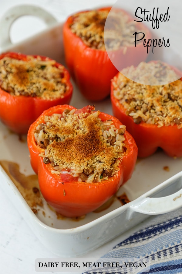 A Pinterest pin for vegan stuffed peppers with lentils and rice.