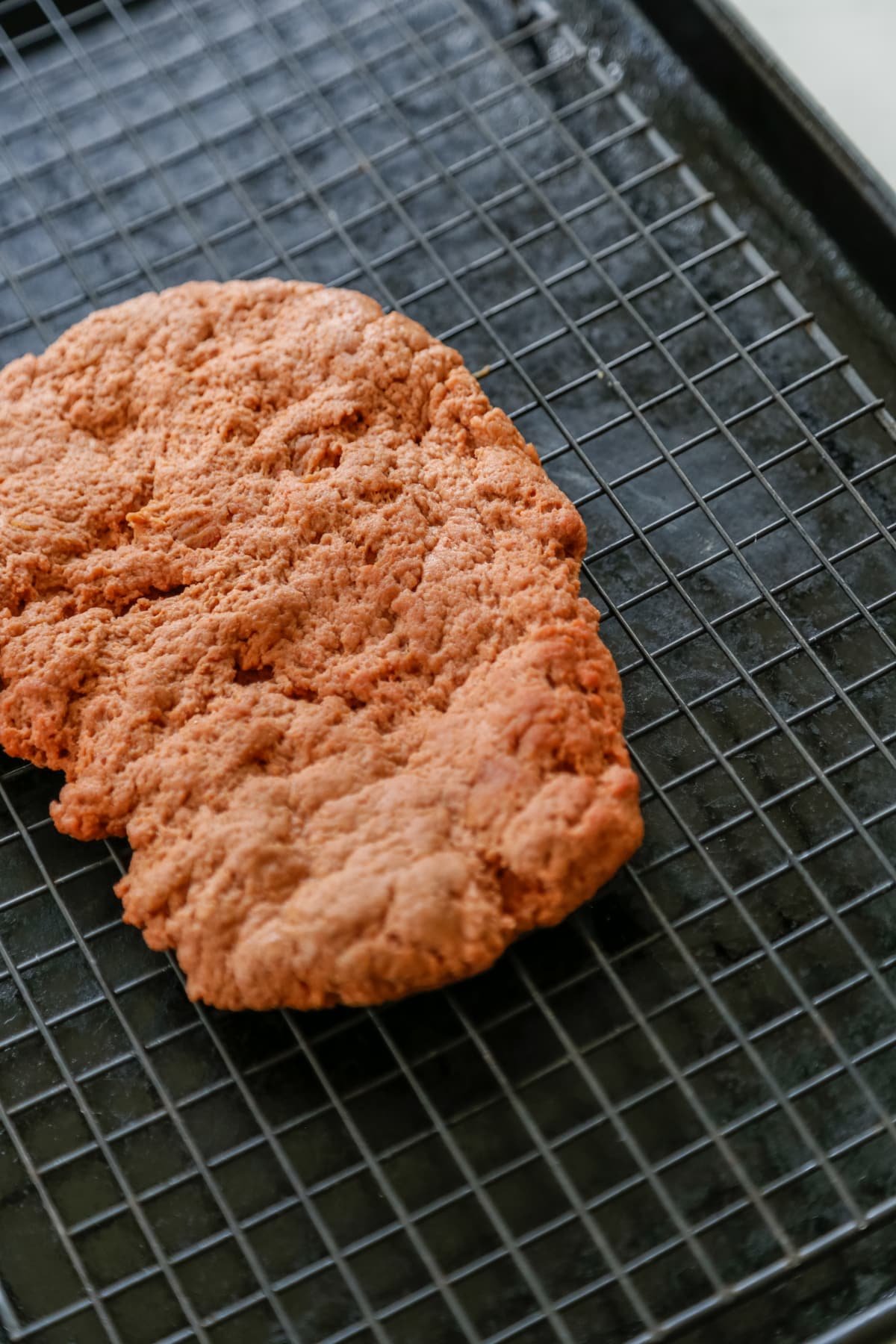 Uncooked vegan ribs on a baking sheet.